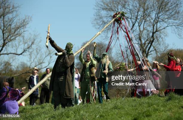Maypole is raised to be used in a Beltane May Day celebration below Glastonbury Tor on May 1, 2013 in Glastonbury, England. Although more synonymous...