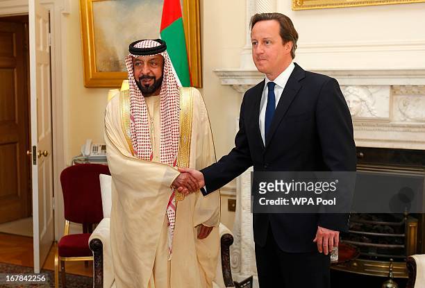 British Prime Minister David Cameron greets the President of the United Arab Emirates Sheikh Khalifa bin Zayed al-Nahayan in 10 Downing Street on May...