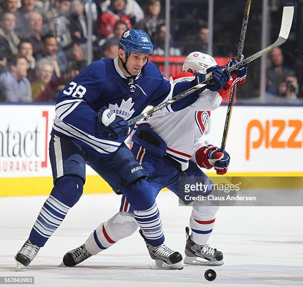 Brendan Gallagher of the Montreal Canadiens battles with Frazer McLaren of the Toronto Maple Leafs in a game on April 27, 2013 at the Air Canada...