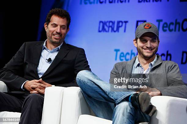 Guy Oseary and Ashton Kutcher of A-Grade speak onstage at TechCrunch Disrupt NY 2013 at The Manhattan Center on May 1, 2013 in New York City.