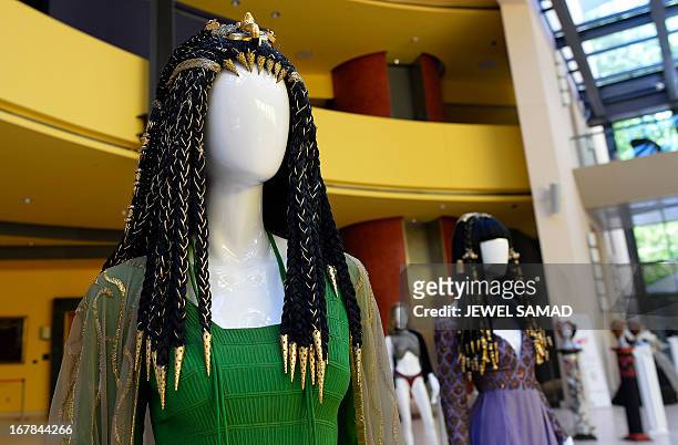 Wigs and dresses worn by actress Elizabeth Taylor in the 1963 film Cleopatra are displayed during an exhibition at the Italian embassy in Washington,...