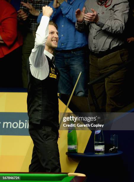 Judd Trump celebrates beating Shaun Murphy during their Quarter Final match in the Betfair World Snooker Championship at the Crucible Theatre on May...