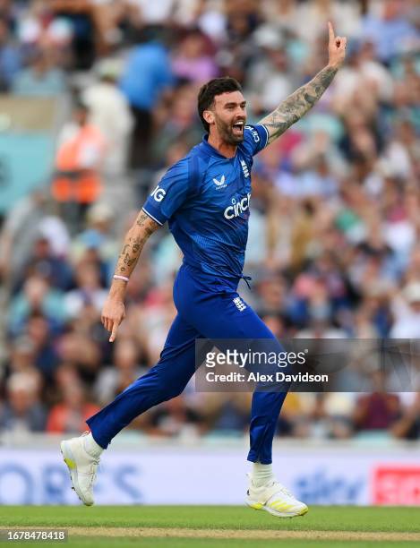 Reece Topley of England celebrates taking the wicket of Devon Conway of New Zealand during the 3rd Metro Bank ODI between England and New Zealand at...