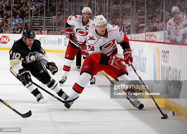 Bobby Sanguinetti of the Carolina Hurricanes moves the puck in front of Brenden Morrow of the Pittsburgh Penguins on April 27, 2013 at Consol Energy...