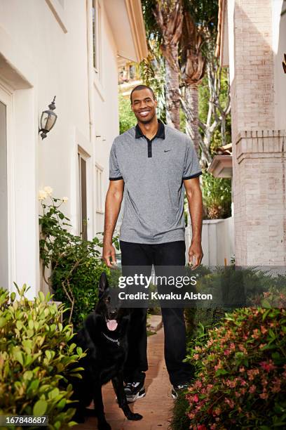 Basketball player Jason Collins is photographed with his german shepherd Shadow for Sports Illustrated on April 25, 2013 in Los Angeles, California....