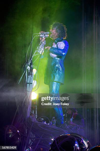 Wayne Coyne of The Flaming Lips holds a baby doll as he performs onstage at Egyptian Room at Old National Centre on April 29, 2013 in Indianapolis,...