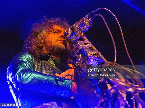 Wayne Coyne of The Flaming Lips holds a baby doll as he performs onstage at Egyptian Room at Old National Centre on April 29, 2013 in Indianapolis,...