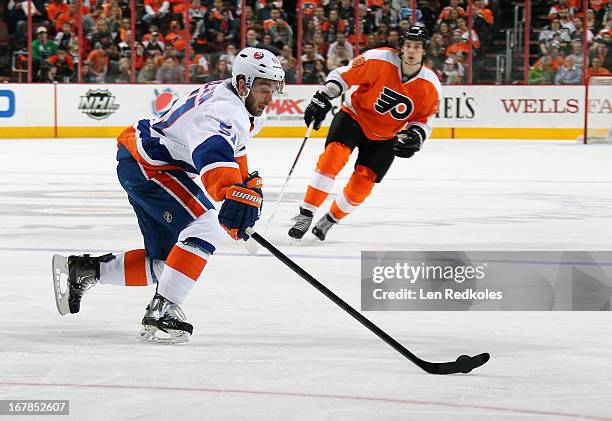 Frans Nielsen of the New York Islanders handles the puck against Oliver Lauridsen of the Philadelphia Flyers on April 25, 2013 at the Wells Fargo...