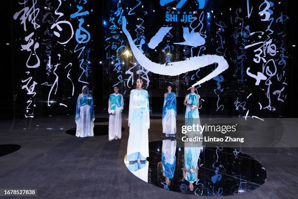 Models walks the runway at SHIJIE collection show by designer Shi Jie during the China Fashion Week S/S 2024 at 751D·PARK on September 13, 2023 in...