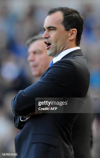 Wigan Athletic's Spanish manager Roberto Martinez watches the action during the English Premier League football match between West Ham United and...