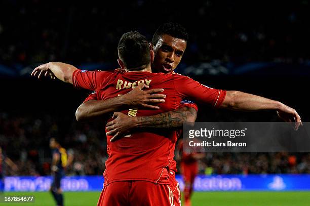 Franck Ribery of Munich and Luiz Gustavo of Munich celebrate after Gerard Pique of Barcelona scores an own goal to make the score 2-0 during the UEFA...