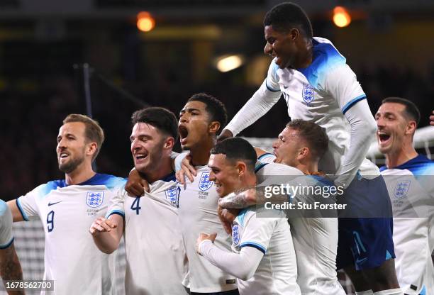 Jude Bellingham of England celebrates with team mates after scoring the team's second goal during the 150th Anniversary Heritage Match between...