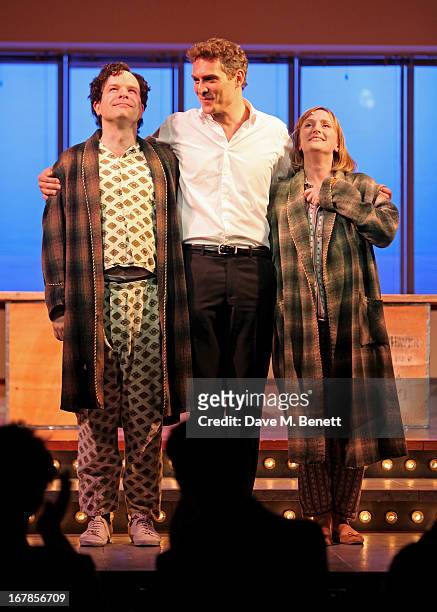 Cast members Damian Humbley, Mark Umbers and Jenna Russell bow at the curtain call during the press night performance of the Menier Chocolate...