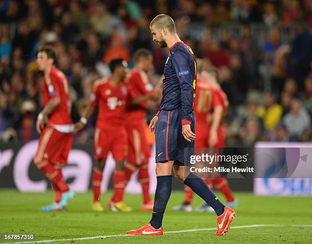 Gerard Pique of Barcelona shows his disappointment after scoring an own goal during the UEFA Champions League semi-final second leg match between...