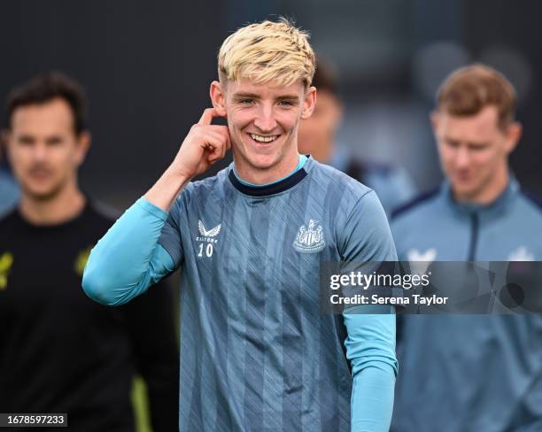 Anthony Gordon smiles during the Newcastle United Training Session at the Newcastle United Training Centre on September 13, 2023 in Newcastle upon...