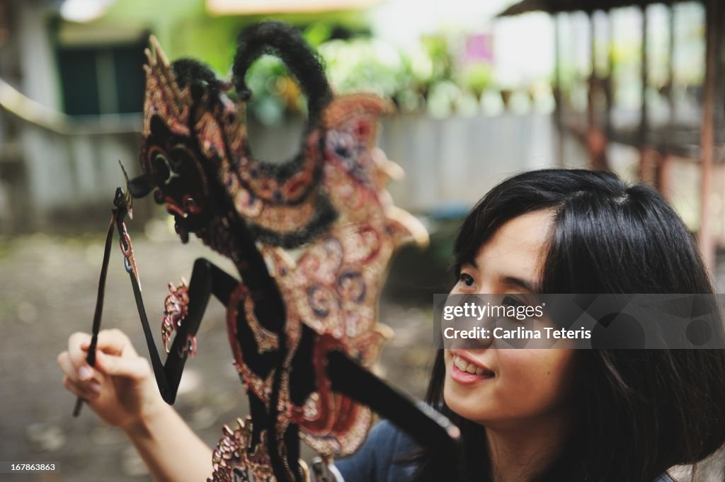 Woman with a shadow puppet