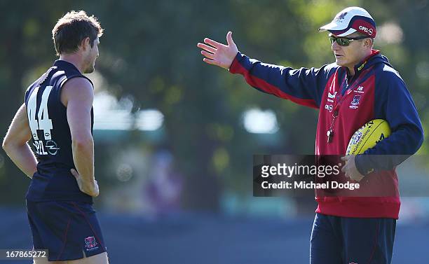 Demons coach Mark Neeld gestures to Rohan Bail during a Melbourne Demons AFL training session at Gosch's Paddock on May 2, 2013 in Melbourne,...