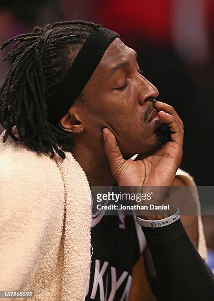 Gerald Wallace of the Brooklyn Nets sits on the bench in Game Three of the Eastern Conference Quarterfinals during the 2013 NBA Playoffs against the...