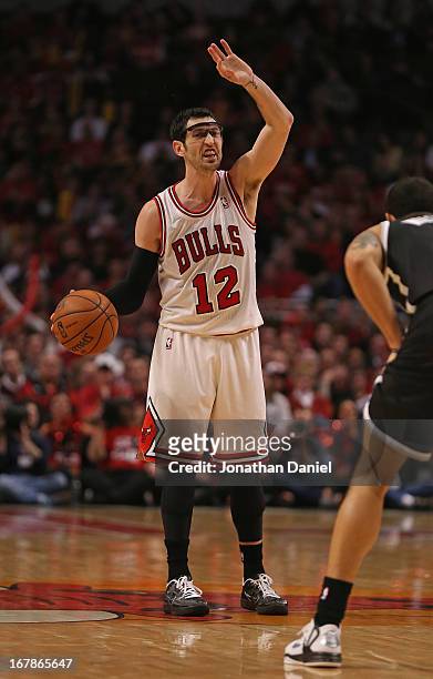 Kirk Hinrich of the Chicago Bulls signals a play against the Brooklyn Nets in Game Three of the Eastern Conference Quarterfinals during the 2013 NBA...