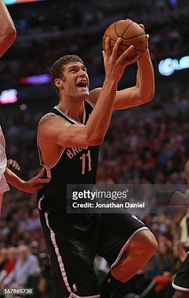 Brook Lopez of the Brooklyn Nets moves the Chicago Bulls in Game Three of the Eastern Conference Quarterfinals during the 2013 NBA Playoffs at the...