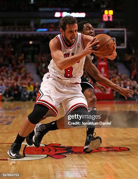 Marco Belinelli of the Chicago Bulls drives past MarShon Brooks of the Brooklyn Nets in Game Three of the Eastern Conference Quarterfinals during the...