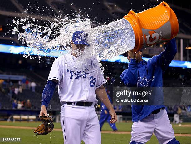 Elliot Johnson of the Kansas City Royals is doused with water by George Kottaras after their 9-8 win over the Tampa Bay Rays at Kauffman Stadium on...