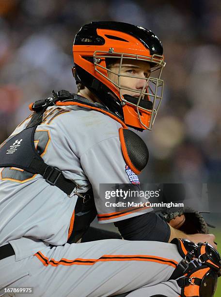 Buster Posey of the San Francisco Giants looks on during Game Three of the World Series against the Detroit Tigers at Comerica Park on October 27,...