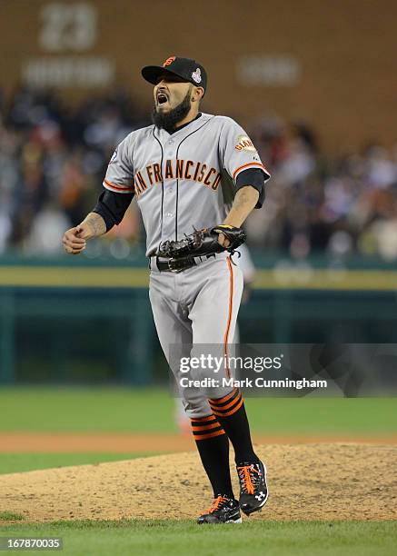 Sergio Romo of the San Francisco Giants reacts to getting the final out of Game Three of the World Series against the Detroit Tigers at Comerica Park...