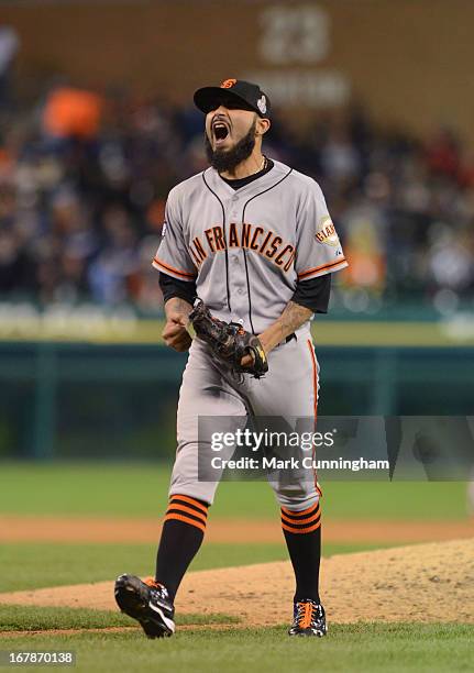 Sergio Romo of the San Francisco Giants reacts to getting the final out of Game Three of the World Series against the Detroit Tigers at Comerica Park...