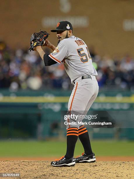 Sergio Romo of the San Francisco Giants pitches during Game Three of the World Series against the Detroit Tigers at Comerica Park on October 27, 2012...
