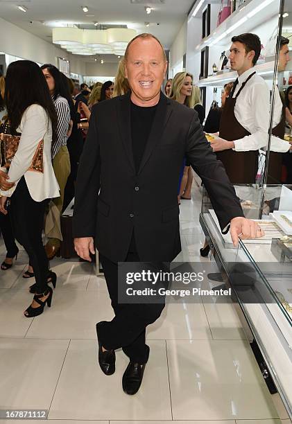 Fashion Designer Michael Kors Join Top Clients at Michael Kors Canadian Flagship Store on May 1, 2013 in Toronto, Canada.