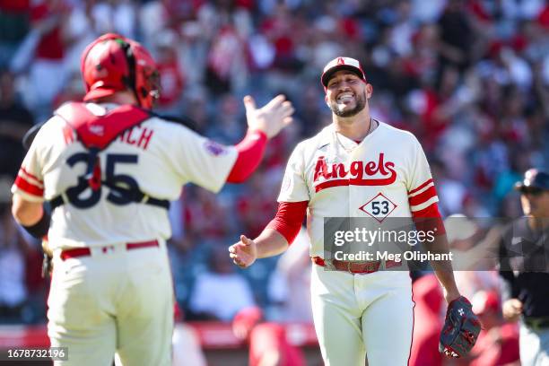 Chad Wallach and Carlos Estevez of the Los Angeles Angels celebrate after defeating the Cleveland Guardians at Angel Stadium of Anaheim on September...