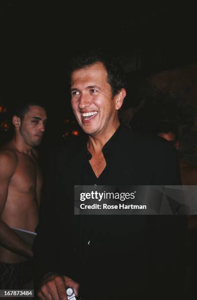Fashion photographer Mario Testino at the Visionaire magazine party at Maxim's, Paris, 1997.