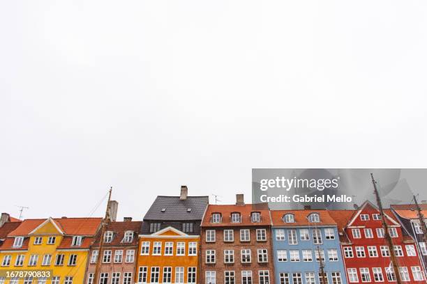 views of nyhavn area in copenhagen - house denmark stock-fotos und bilder