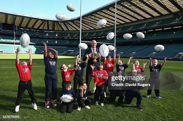 England 2015 ambassador Lawrence Dallaglio, poses with school children during the IRB Rugby World Cup 2015 Schedule Annoucement held at Twickenham...