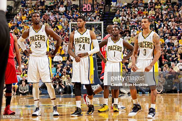 Indiana Pacers players Roy Hibbert, Paul George, Lance Stephenson and George Hill wait to resume play action against the Atlanta Hawks in Game Five...