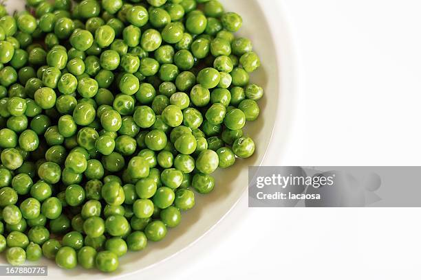 white plate full of peas - peas stock pictures, royalty-free photos & images