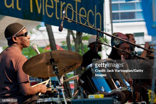 Nigerian Afro-Beat musician Tony Allen plays drums as he leads his band during a performance at the BAM Rhythm and Blues Festival concert at...