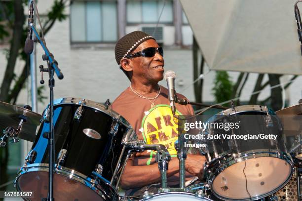 Nigerian Afro-Beat musician Tony Allen plays drums as he leads his band during a performance at the BAM Rhythm and Blues Festival concert at...