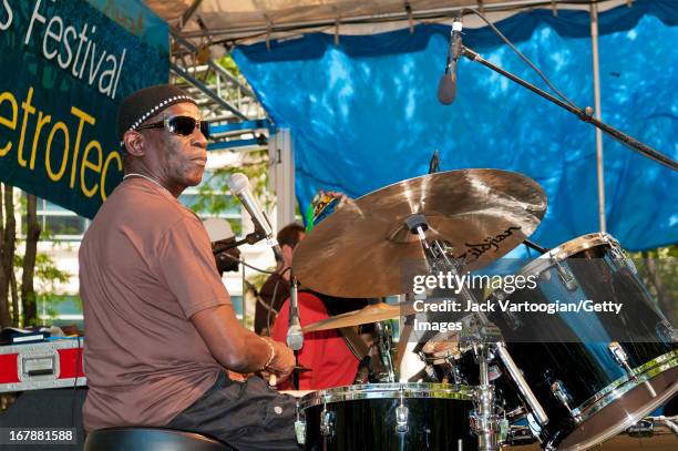 Nigerian Afro-Beat musician Tony Allen plays drums as he leads his band during a performance at the BAM Rhythm and Blues Festival concert at...