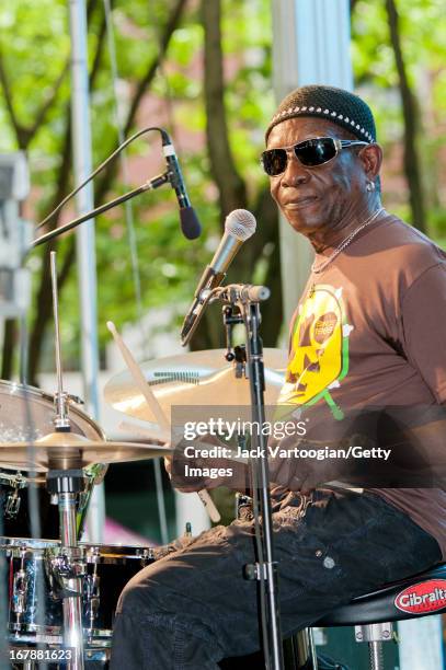 Nigerian Afro-Beat musician Tony Allen plays drums as he leads his band during a performance at the BAM Rhythm and Blues Festival concert at...