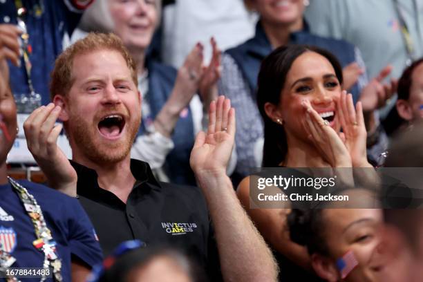 Prince Harry, Duke of Sussex and Meghan, Duchess of Sussex cheer the competitors during the Wheelchair Basketball Finals between USA and France at...