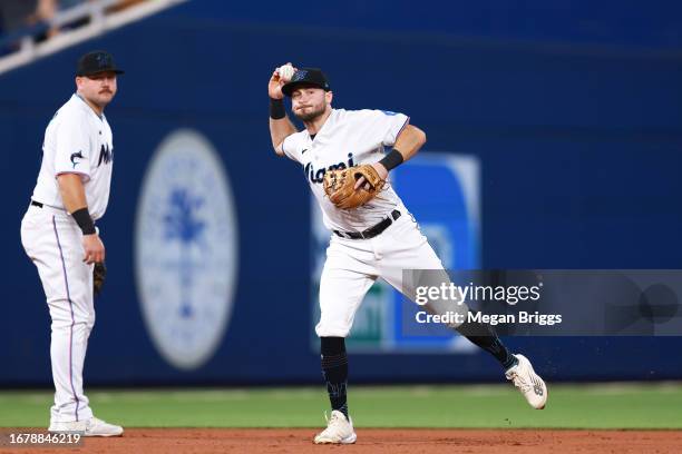 Garrett Hampson of the Miami Marlins throws to first base against the Los Angeles Dodgers during the second inning at loanDepot park on September 05,...