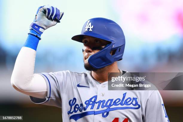 Miguel Rojas of the Los Angeles Dodgers reacts after hitting a single against the Miami Marlins during the third inning at loanDepot park on...