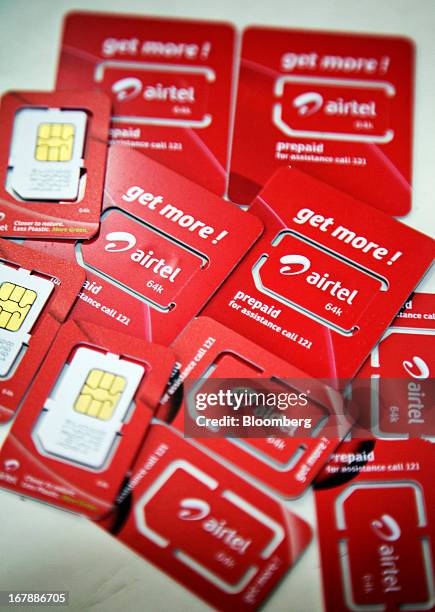 Bharti Airtel Ltd. SIM cards are displayed for a photograph at the company's flagship store in Mumbai, India on Thursday, May 2, 2013. Bharti Airtel,...