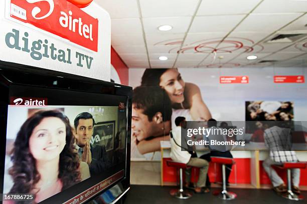 Bharti Airtel Ltd. Digital TV stands on display at the company's flagship store in Mumbai, India on Thursday, May 2, 2013. Bharti Airtel, India's...