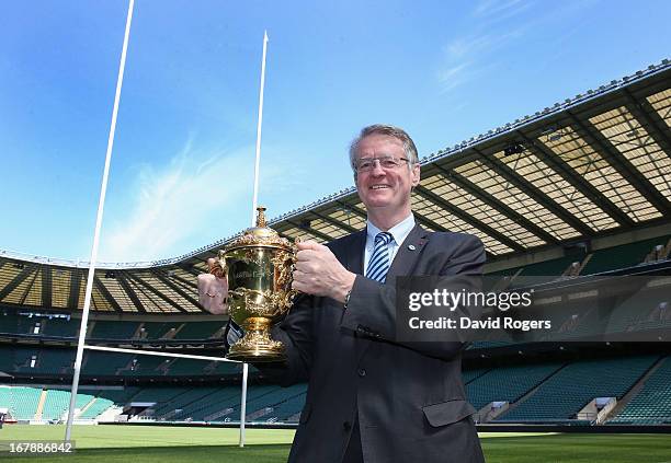 Bernard Lapasset, RWCL Chairman, holds the Webb Ellis Cup during the IRB Rugby World Cup 2015 Schedule Announcement held at Twickenham Stadium on May...