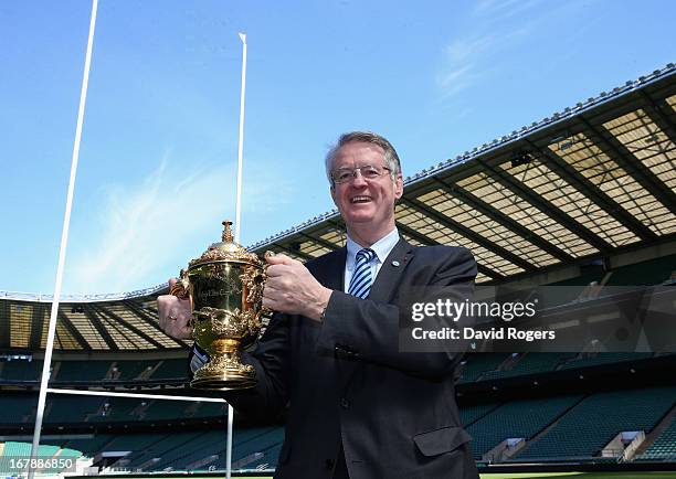 Bernard Lapasset, RWCL Chairman, holds the Webb Ellis Cup during the IRB Rugby World Cup 2015 Schedule Announcement held at Twickenham Stadium on May...