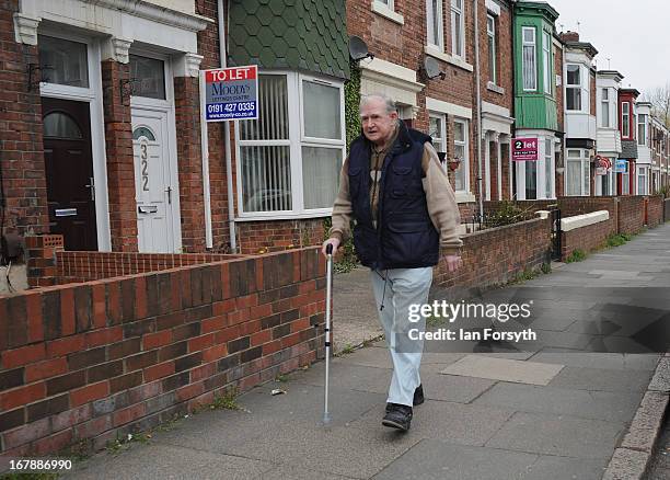 An elderly man walks up a street as voters head to the polls on May 2, 2013 in South Shields, England. The by-election was triggered after the former...