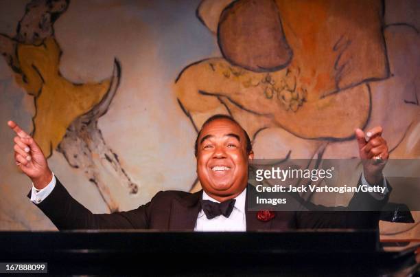 American cabaret musician Bobby Short performs at the piano on the opening night of his 34th Spring Season at the Cafe Carlyle, New York, New York,...